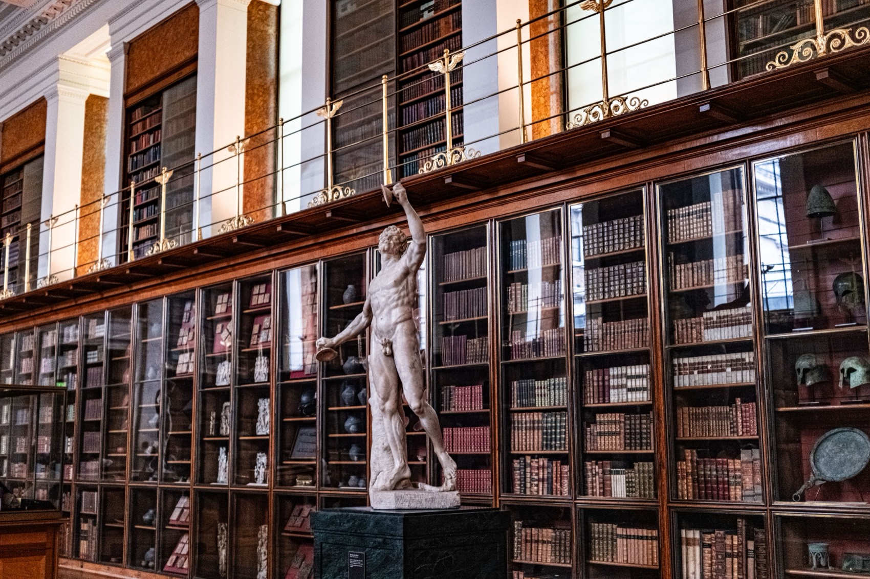 Grand library interior with classical statue