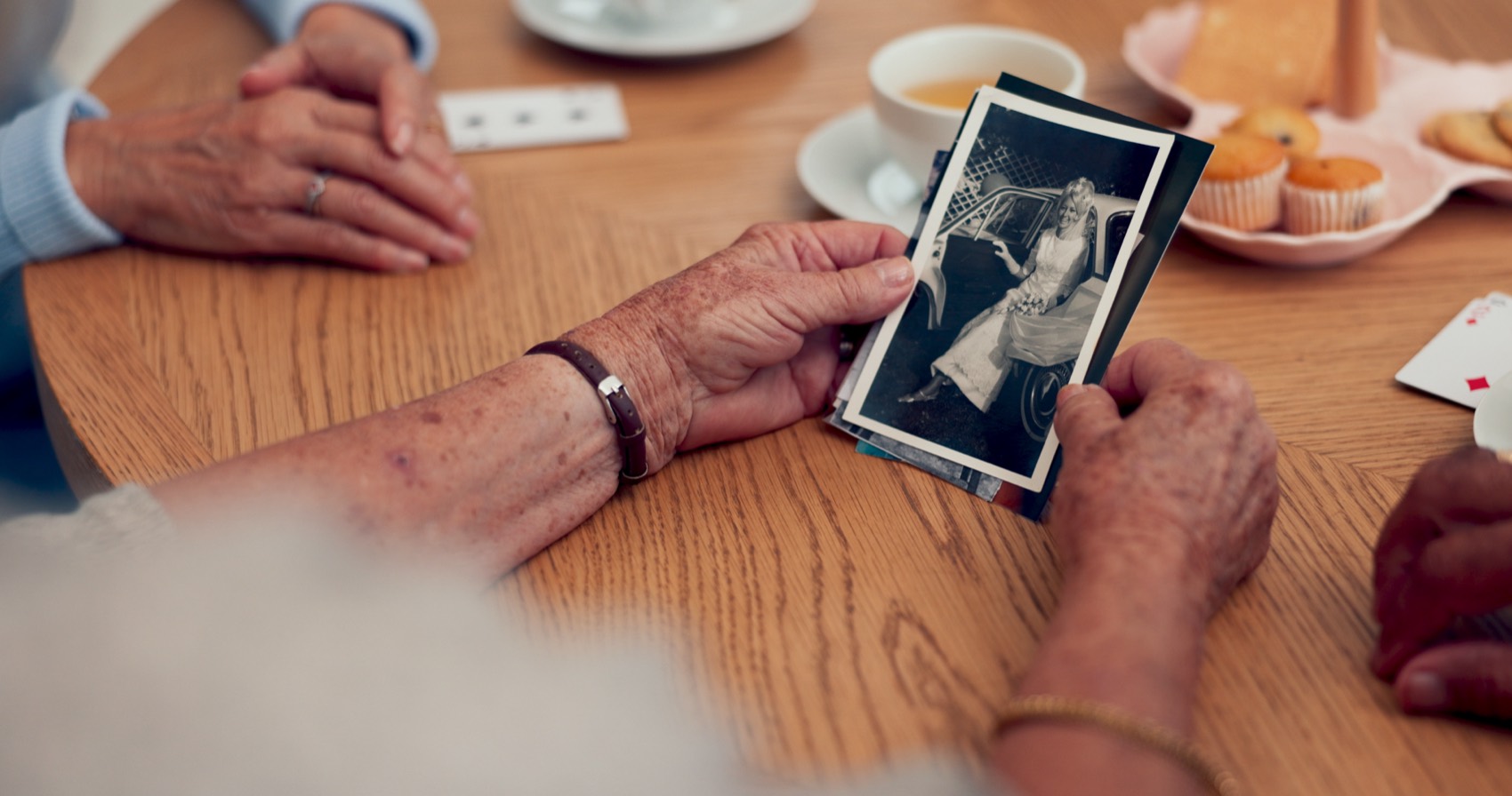 Seniors looking at vintage family photos